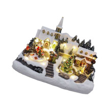 Weihnachtliches Hausornament aus Kunstharz mit eingebauten