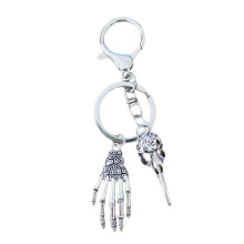 Porte-clés créatif tête d'oiseau crâne main porte-clés sac