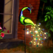 Décoration lumineuse solaire en métal en forme de paon, idéale pour décorer une terrasse, une allée ou un jardin. Allumage et extinction