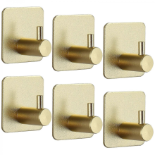 Lot de 6 crochets muraux adhésifs en acier inoxydable doré, robustes et étanches, sans perçage, pour cuisine et salle de bain.