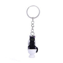 Ravissant porte-clés de chat de-Chat de toilette assis noir