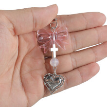Pendentifs en forme de cœur et de croix avec nœud-amour