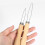 Hook wooden handle wire loop through button helper assist device tool pull 2