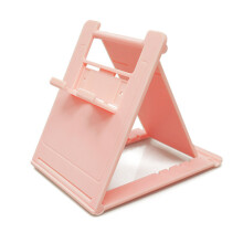 Supporto pieghevole compatto per Nintendo Switch con cuscinetti in silicone antiscivolo. Permette di giocare e ricaricare contemporaneamente. Design