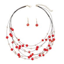 Handgemaakte meerlaagse ketting en oorbellen, bohemian statement ketting met verfijnde afwerking en verstelbare maat, levendige natuurlijke kleuren.