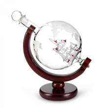 An etched globe-shaped decanter with an engraved spherical glass base, suitable for spirits, whiskey, and bourbon.