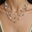 Colar de pérolas elegante para mulheres, colar de pérolas extra longo com design de camélia vazada, corrente de suéter com várias camadas de 4