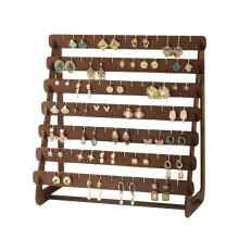 Présentoir à boucles d'oreilles en bois de style vintage pour salon, chambre ou bureau, avec crochets et supports.