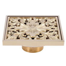 Goldener quadratischer Bodenablauf für Dusche und WC mit Siebfilter für saubere Entwässerung.