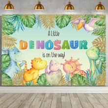 Décor de baby shower sur le thème des dinosaures, avec feuilles de palmier tropicales, bannière safari jungle et inscription « Un petit dinosaure
