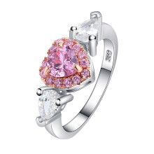 Anello da donna con zirconi, ciondolo a forma di cuore color pesca rosa, griffe e goccia d'acqua, con diamanti.