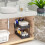 Sliding double-layer storage drawer rack for with hooks under the sink for kitchen storage. 4