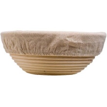 Panier Ă pain rond pour la fermentation, facile Ă utiliser, avec revĂŞtement en tissu lavable.