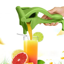 Family fruit juice squeezing, stainless steel juice press, hands squeezing hands, hand portable citrus
