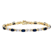 Bracelet Ă breloques en or jaune 9 carats, diamant rond de 5 points et saphir ovale de 7,6 carats, motif baiser