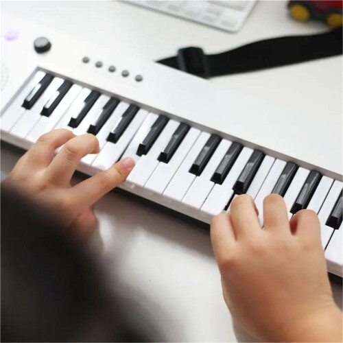 37 Key Electronic Keyboard with Microphone USB Rechargeable Digital Piano White with Strap 1