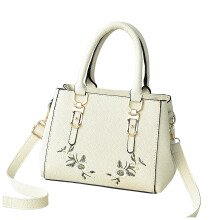 Sac bandoulière en cuir blanc, brodé, avec poignée supérieure, idéal pour les voyages.