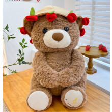 Urso de pelúcia natalino com buquê de rosas vermelhas, marrom.