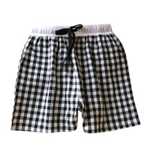 Shorts de dormir xadrez feminino com bolsos, tecido macio e respirável, cordão ajustável, modelagem solta, tamanhos M a XL.
