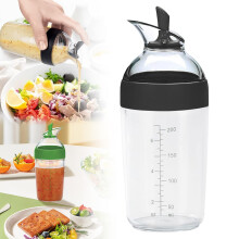 Botella mezcladora para aderezo de ensaladas de 240 ml con marcas de medición.