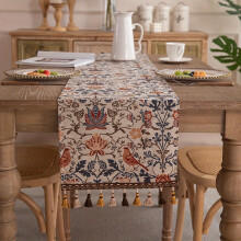 Camino de mesa vintage de jacquard con estampado floral de pájaros y borlas.