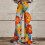 Calça feminina casual estampada com bolsos com zíper e botão. 1