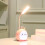 Luminária de mesa LED com braço flexível ajustável, base kawaii e USB. 4