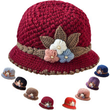Women's French-style knitted wool beanie with floral detail
