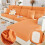 Housse extensible pour canapé deux places – Orange 1
