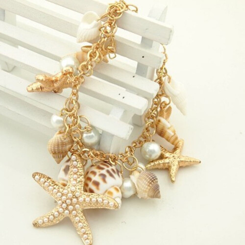 Bracciale da donna con conchiglie, stelle marine e perle finte. 2