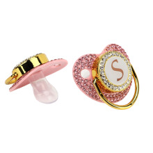 Baby-Milchpulver-Nuckel-Silikon-Brunnen mit Rhinestone, gebogener Buchstabe S Design