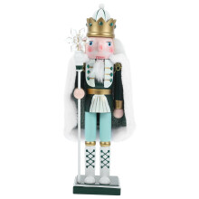 Kerstversiering van een houten notenkraker: een kleine houten notenkraker met cape.