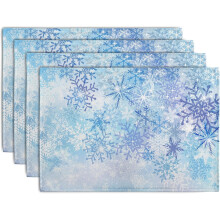 Set van 4 placemats met blauwe sneeuwvlokken in linnen.