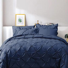 Set copripiumino singolo da 5 pezzi blu navy con lavorazione a pieghe, composto da copripiumino, lenzuola, federe con volant e federe per cuscini.