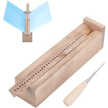 Outil de perforation pour reliure de livres en bois