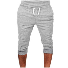 Pantalones capri jogger 3/4 para hombre, ideales para entrenar en el gimnasio. Pantalones cortos por debajo de la rodilla con cremallera y bolsillos.