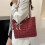 Bolsa transversal xadrez preta, branca e vermelha 1