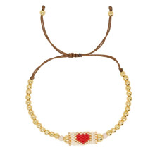 Pulsera bohemia ligera con detalles en oro y cristal. Joyería única para la muñeca.