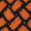 Knyttet orange/sort kokos tæppe 16
