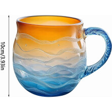 Tazza in vetro marino soffiato a mano con motivo tramonto e onde.
