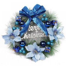 Christmas pine wreath with blue bow and ornaments
