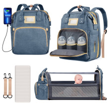 Mochila para fraldas multifuncional azul-escura com suporte para berço.