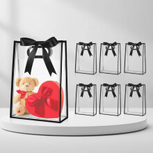 Lot de 12 sacs cadeaux transparents en plastique avec poignées découpées, réutilisables et munis d'un ruban – 17,8 x 25,4 x 8 cm, noirs