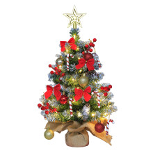 Mini árbol de Navidad de mesa iluminado con adornos.