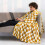 Yellow checkered flannel blanket with black and white 5
