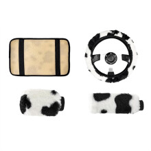 4-Piece Cow Print Car Accessory Set: Steering Wheel Cover and Handbrake Cover, Armrest Mat and Gear Shift Lever Cover.
