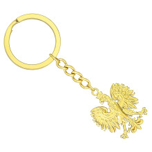 Sleutelhanger met Pools symbool, goud- en zilverkleurige metalen hanger.