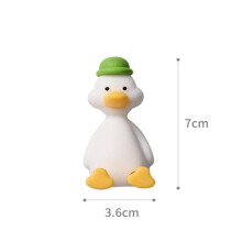 Porte-brosse à dents en silicone en forme de canard vert poli. Support mural tridimensionnel peu encombrant sans perforation.