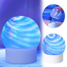 Luminária de mesa Planet com projeção de luz ambiente em 16 cores.