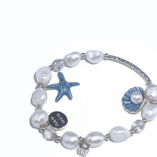 Armband met oceaanparel en kristallen kralen en een zeesterhangertje